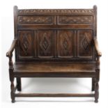 An antique oak settee.