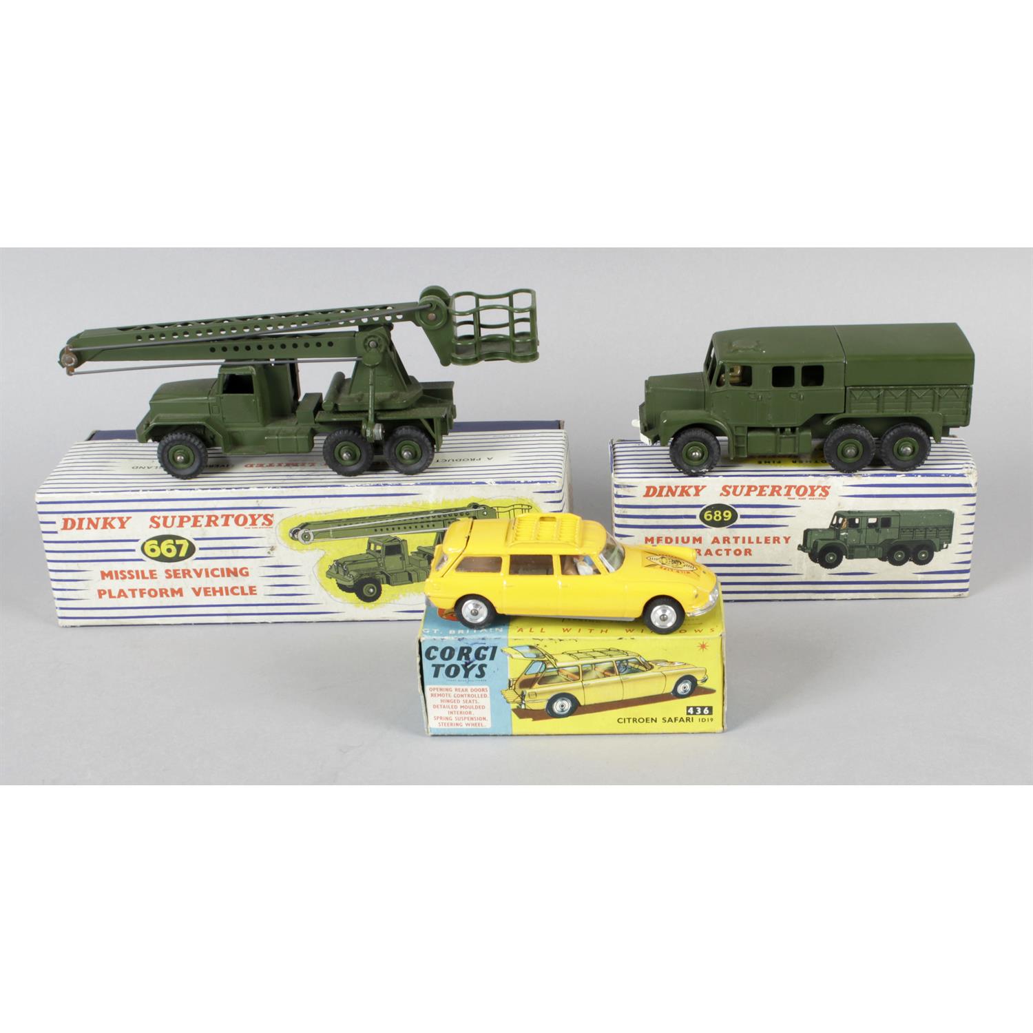 Two boxed Dinky toy models and a Corgi toy model.