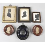 A selection of painted silhouettes, together with a pair of moulded miniatures.