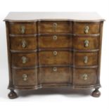 A walnut and mahogany veneered cross banded chest of drawers.