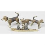 An early 20th century cast metal cat figure group, plus similar examples.