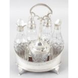 A George III silver and glass cruet set.