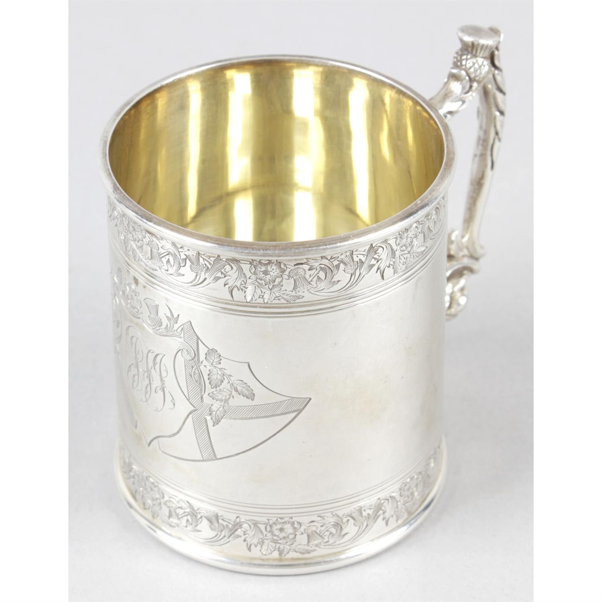 A George V silver christening mug.