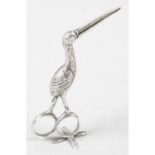 A late 19th century silver stork umbilical cord clamp with import mark.