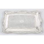 An Edwardian silver dressing table tray.