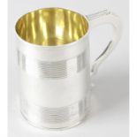 A George III silver mug with reeded detail.