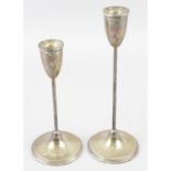Two American sterling silver candlesticks (filled).