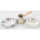 Two Egyptian silver nut/bonbon dishes, together with an Egyptian silver brandy or hot sauce pan.