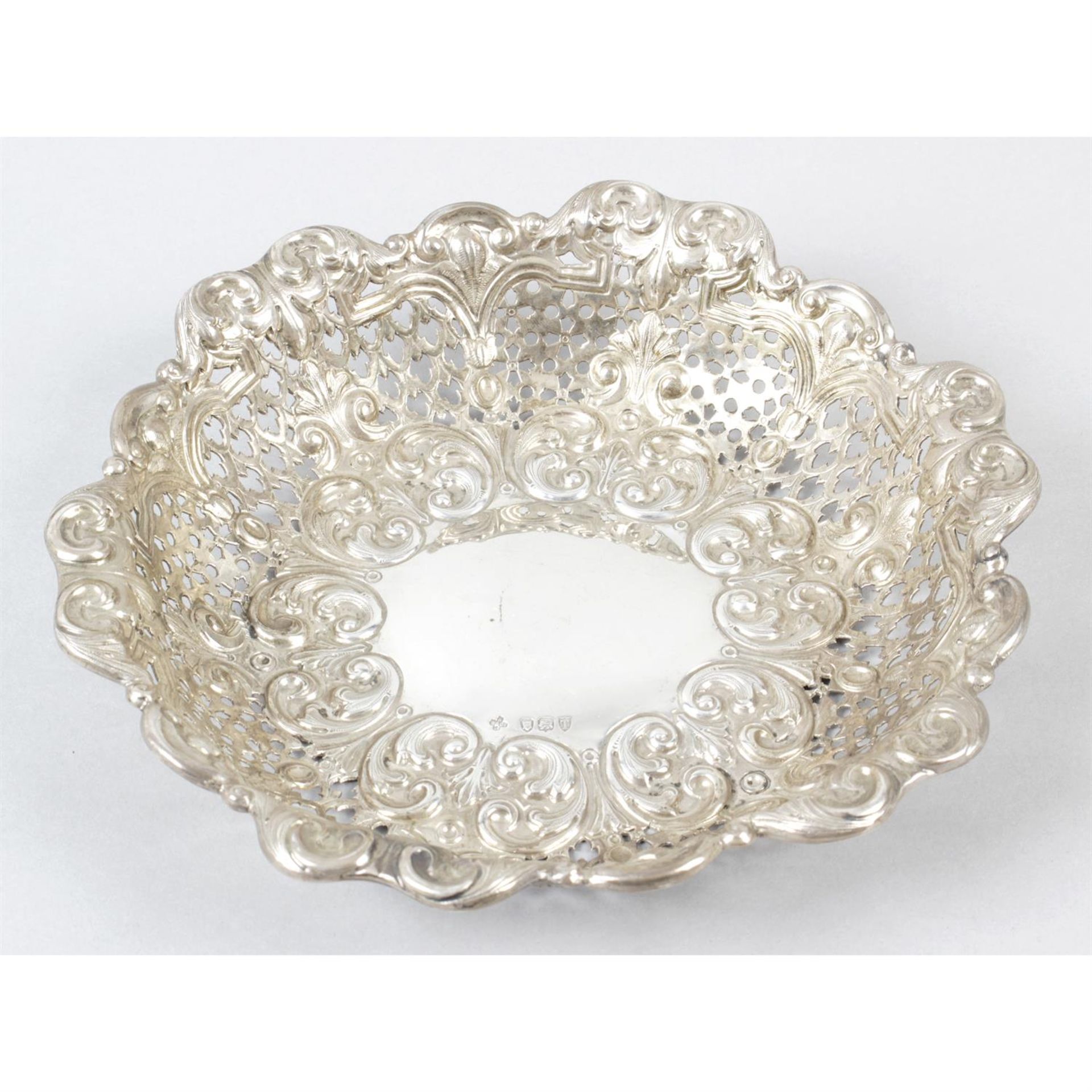 A late Victorian silver pierced and embossed dish.