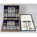 Two cased sets of mother-of-pearl handled silver plate dessert knives and forks, a cased set of