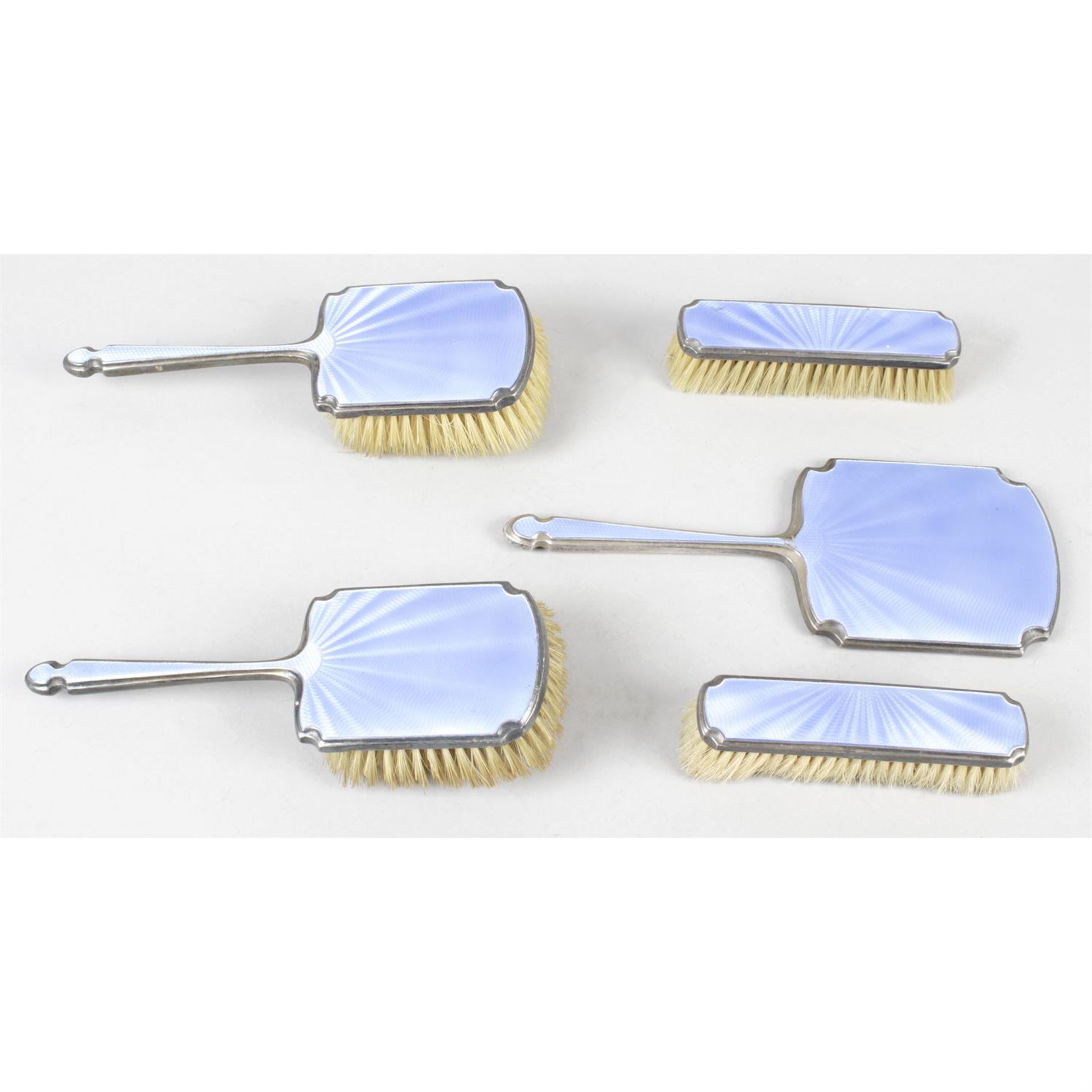 A 1930's silver and guilloché enamel part dressing table set, together with a cased