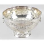 A selection of silver plated items to include a large punch bowl, three cruet/bottle stands,