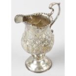 An early George III silver pedestal cream jug.