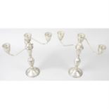 A pair of sterling silver twin-branch candelabra.