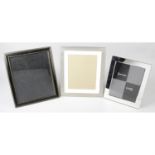 A large mixed selection of assorted easel style photograph frames.
