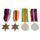 A group of four WWII medals, together with Efficiency Medal (Territorial). (5).