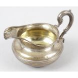 A William IV silver cream jug.