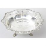 A George V silver pierced dish on shell feet.