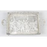 A Dutch silver small twin-handled tray, with embossed scene of 'The Night Watch' after Rembrandt.