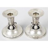A pair of American sterling silver candlesticks.