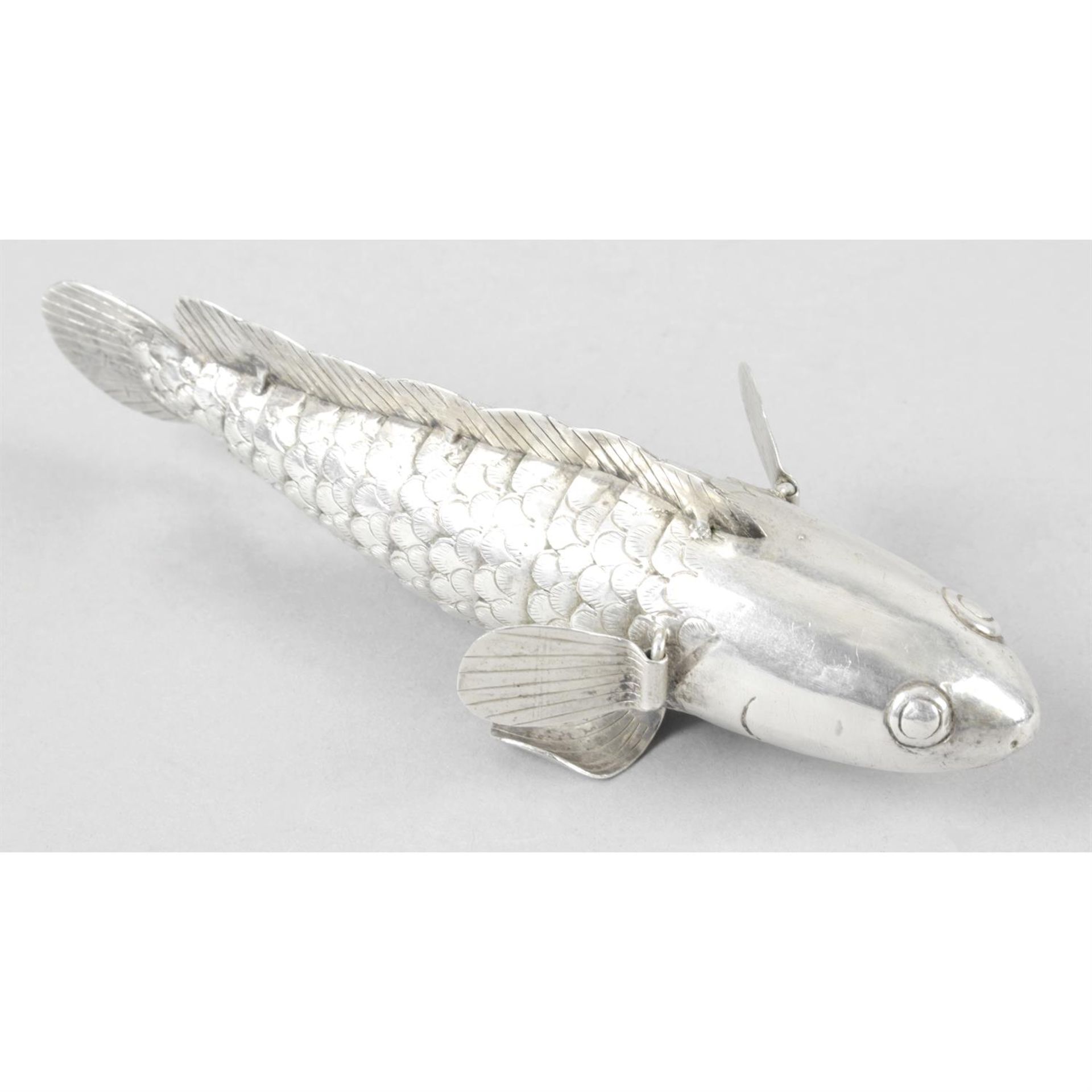 A novelty articulated figure of a fish.