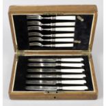 A 1920's cased set of silver & mother-of-pearl fruit knives & forks.