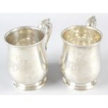 A pair of 1930's silver baluster mugs.