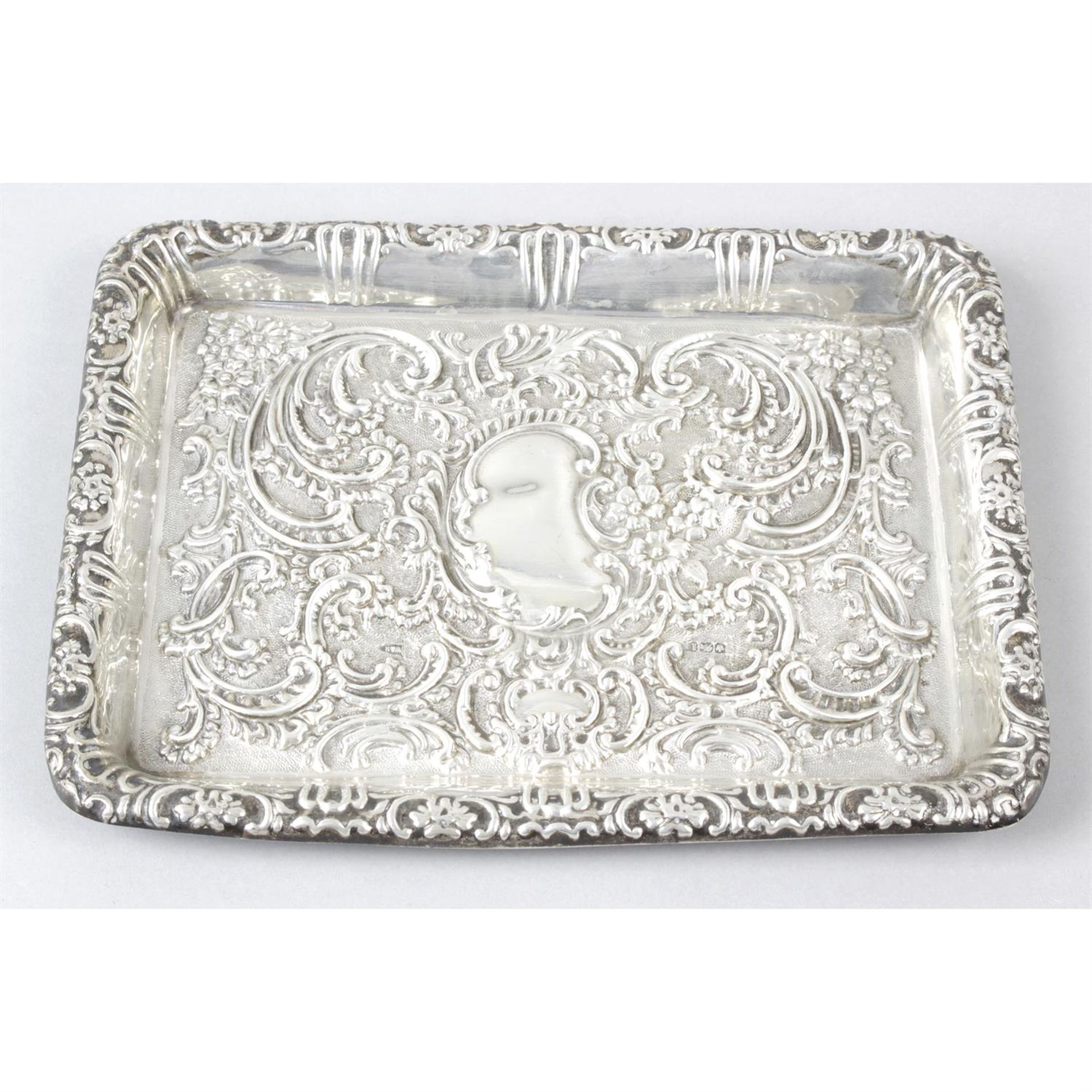 An Edwardian silver embossed dressing table tray by Walker & Hall.