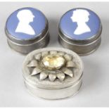 A modern silver citrine set oval box, together with a pair of circular examples with Wedgwood