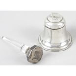 A George V small silver mounted bell shape inkwell, together with a ring stand with sterling silver