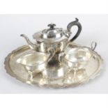 A 1930's silver tea set, comprising teapot, sugar bowl, cream jug and tray.