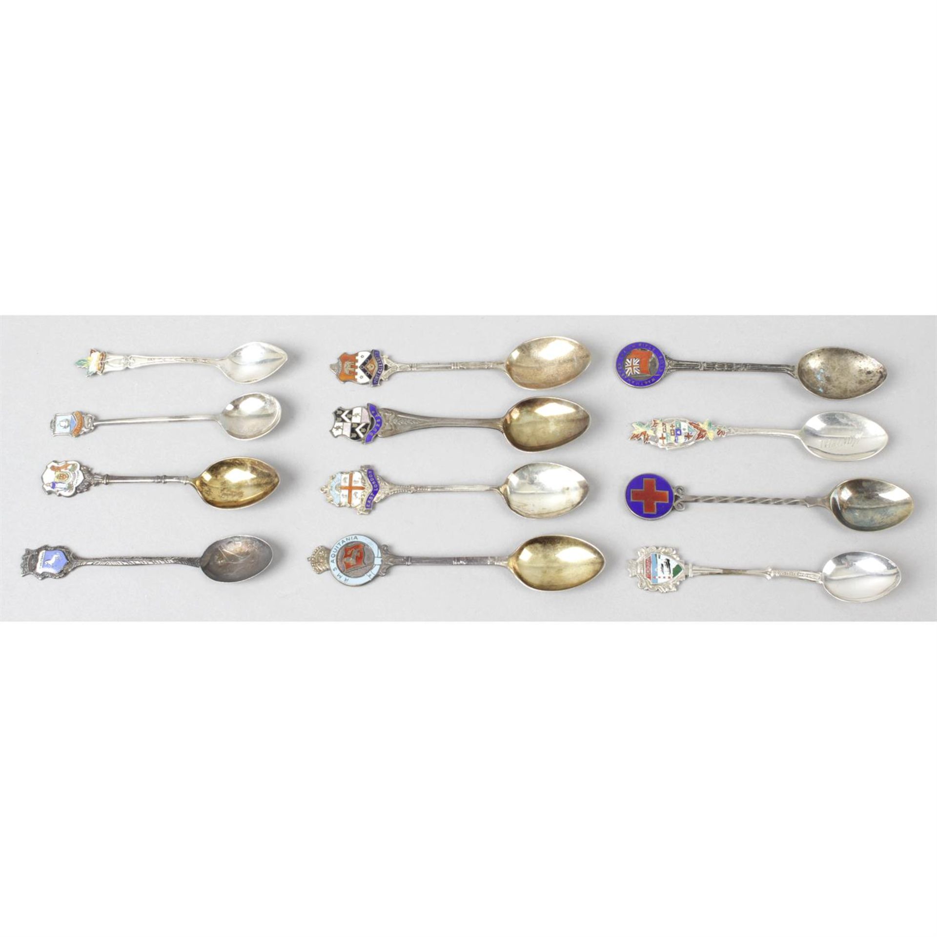 A selection of spoons, etc., to include enamel souvenir examples. (16)