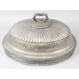 An assortment of silver plate, to include meat cover, candlesticks, biscuit barrel etc. (8)