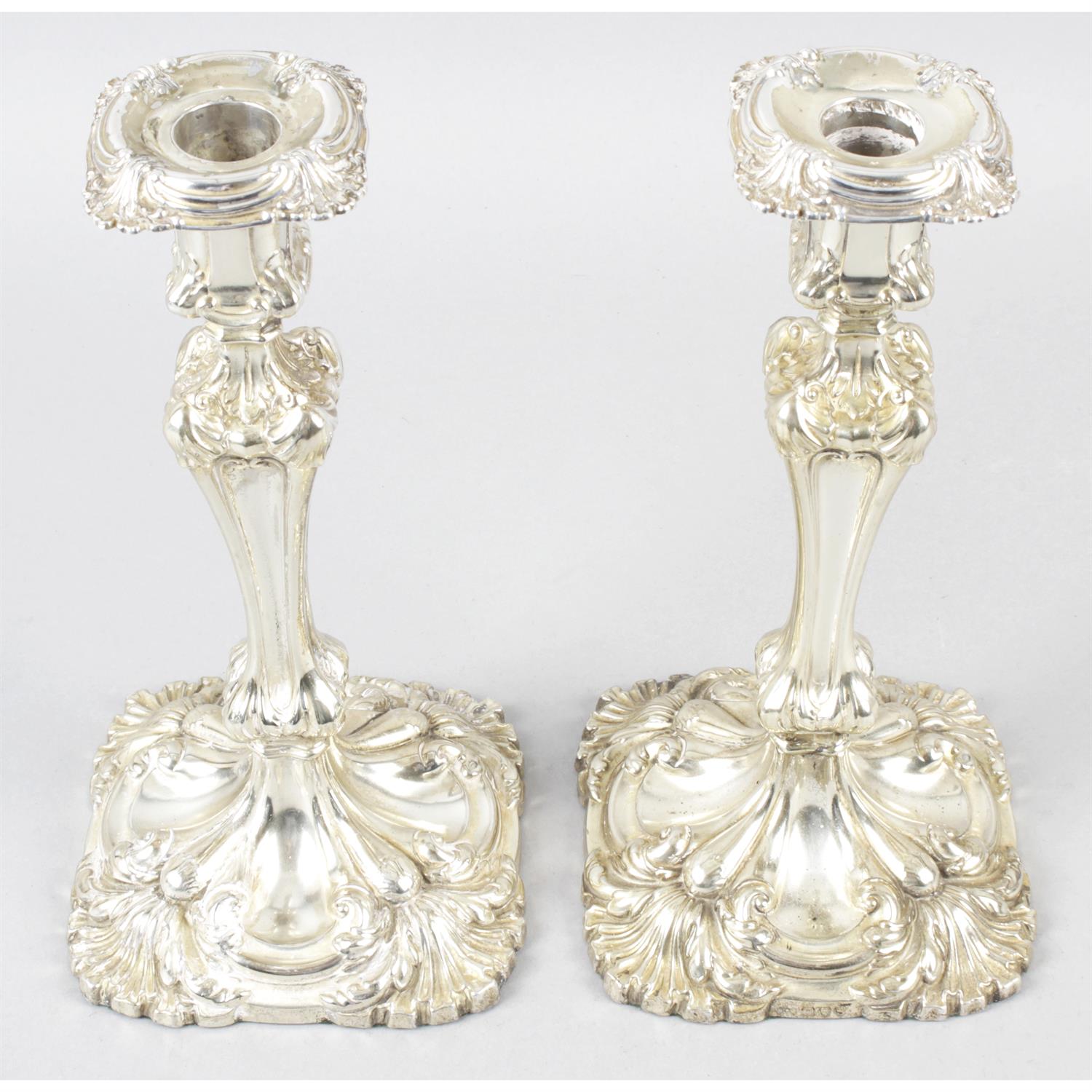 A pair of late Victorian silver candlesticks (filled).