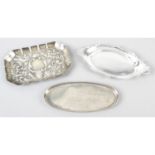 A late Victorian embossed silver small tray/dish, together with two later small dishes/trays. (3).