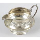 A 1930's small silver cream jug.