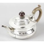A George V silver bachelor teapot.