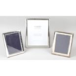 A large mixed selection of assorted easel style photograph frames.