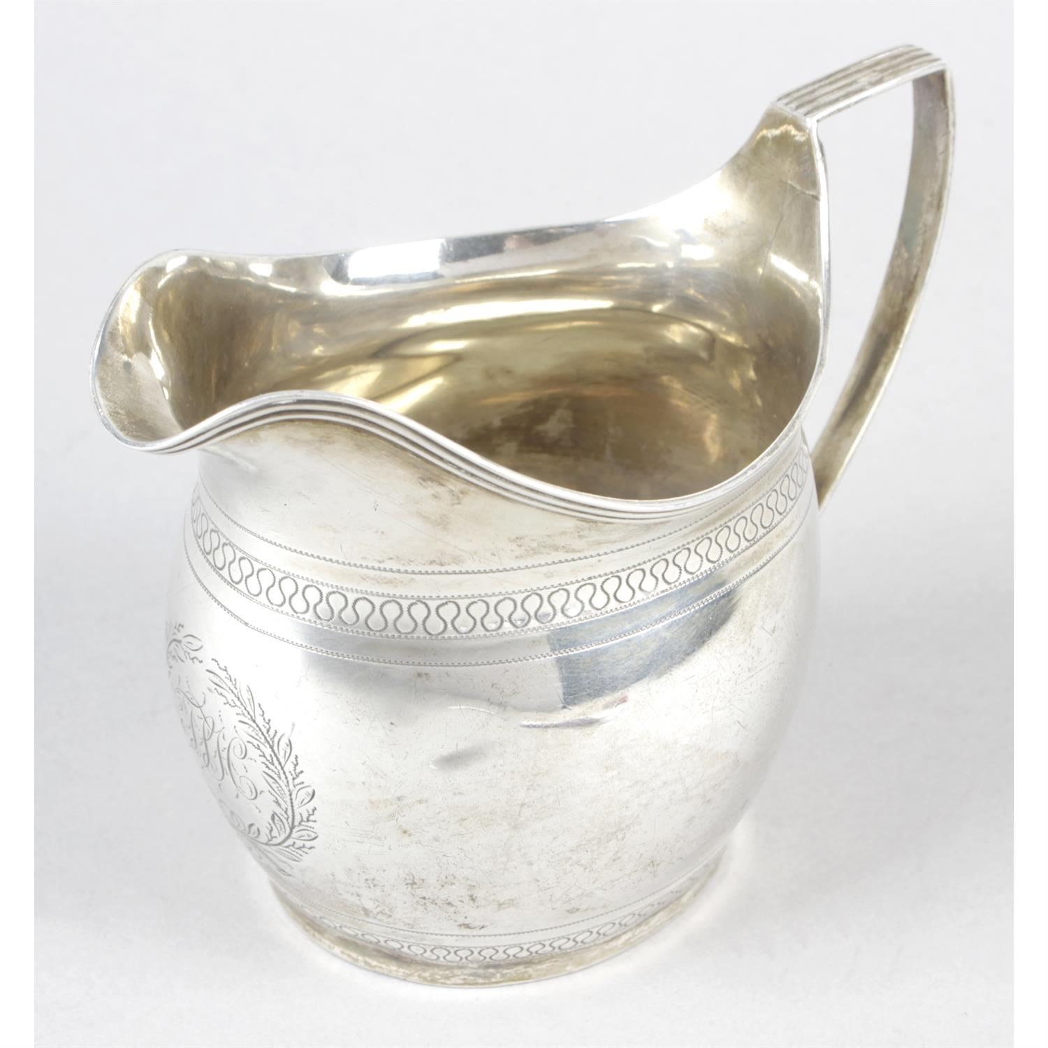 A late George III silver cream jug.