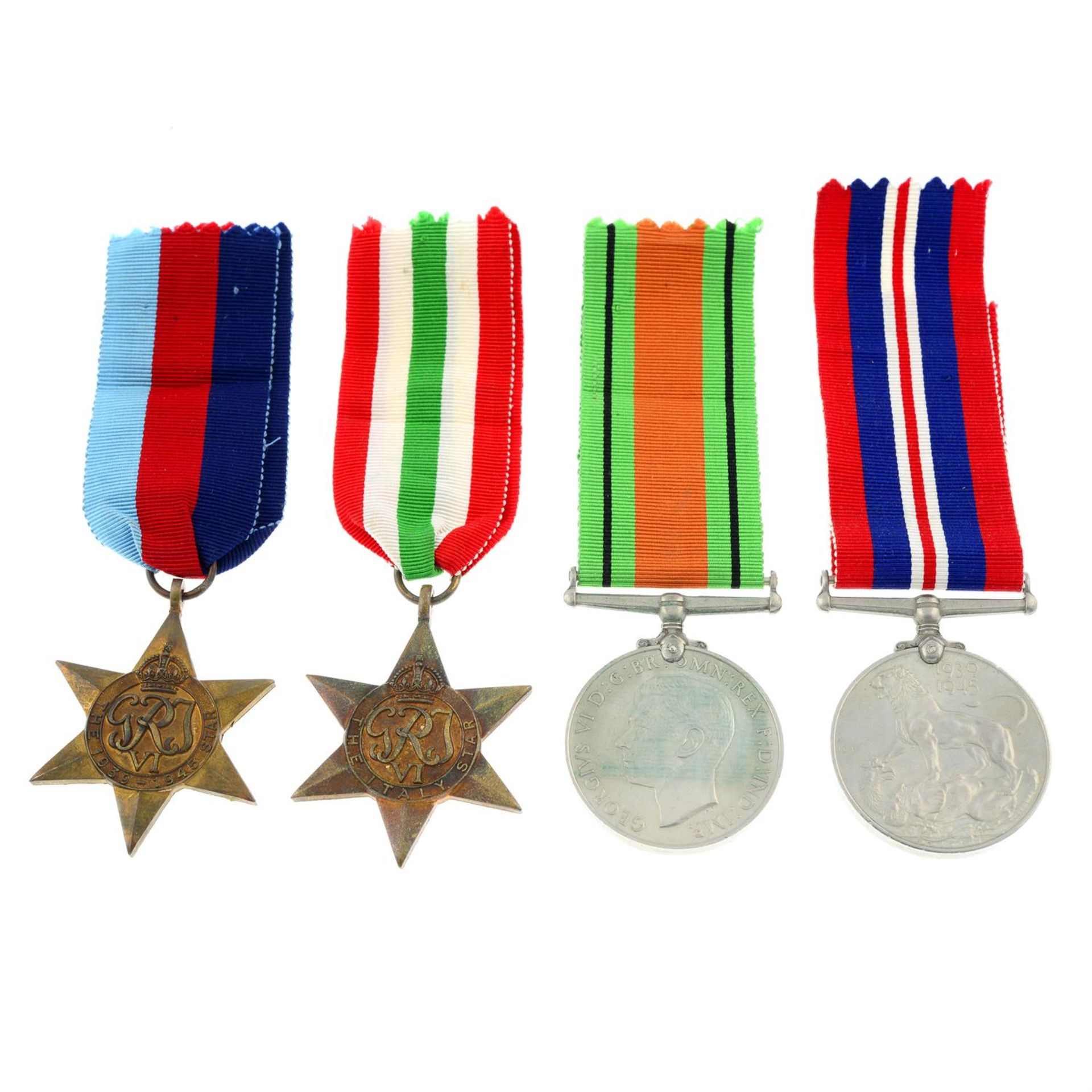 A group of four WWII medals, together with an Air Efficiency Award. (5).