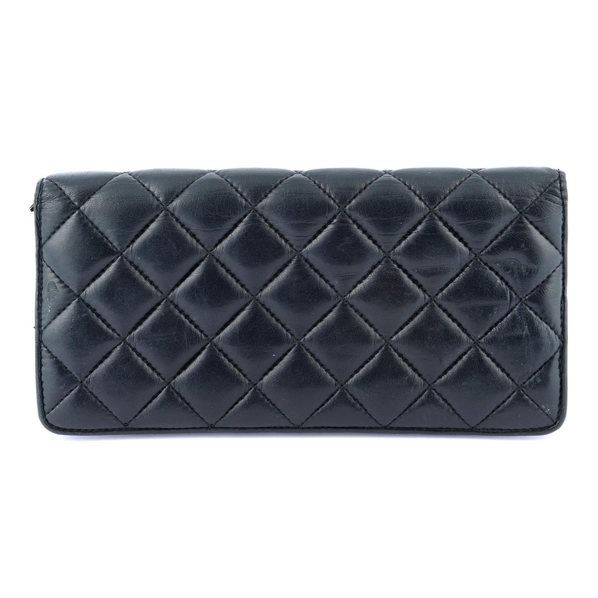 CAROLINA HERRERA - a black quilted leather wallet. - Image 2 of 3