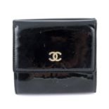 CHANEL - a black patent compact wallet.