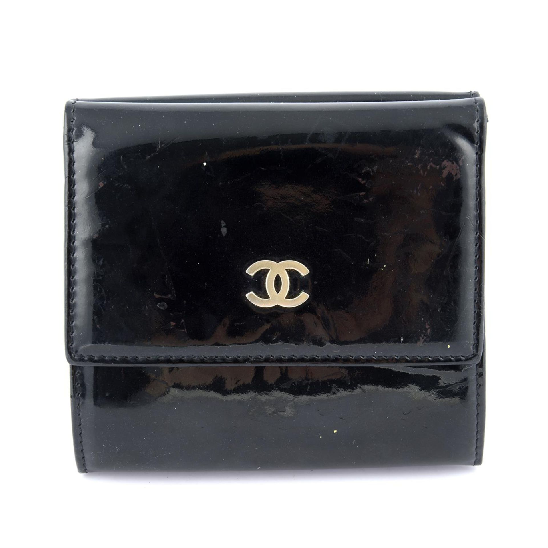 CHANEL - a black patent compact wallet.