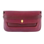 CARTIER - a 1989 red leather clutch.