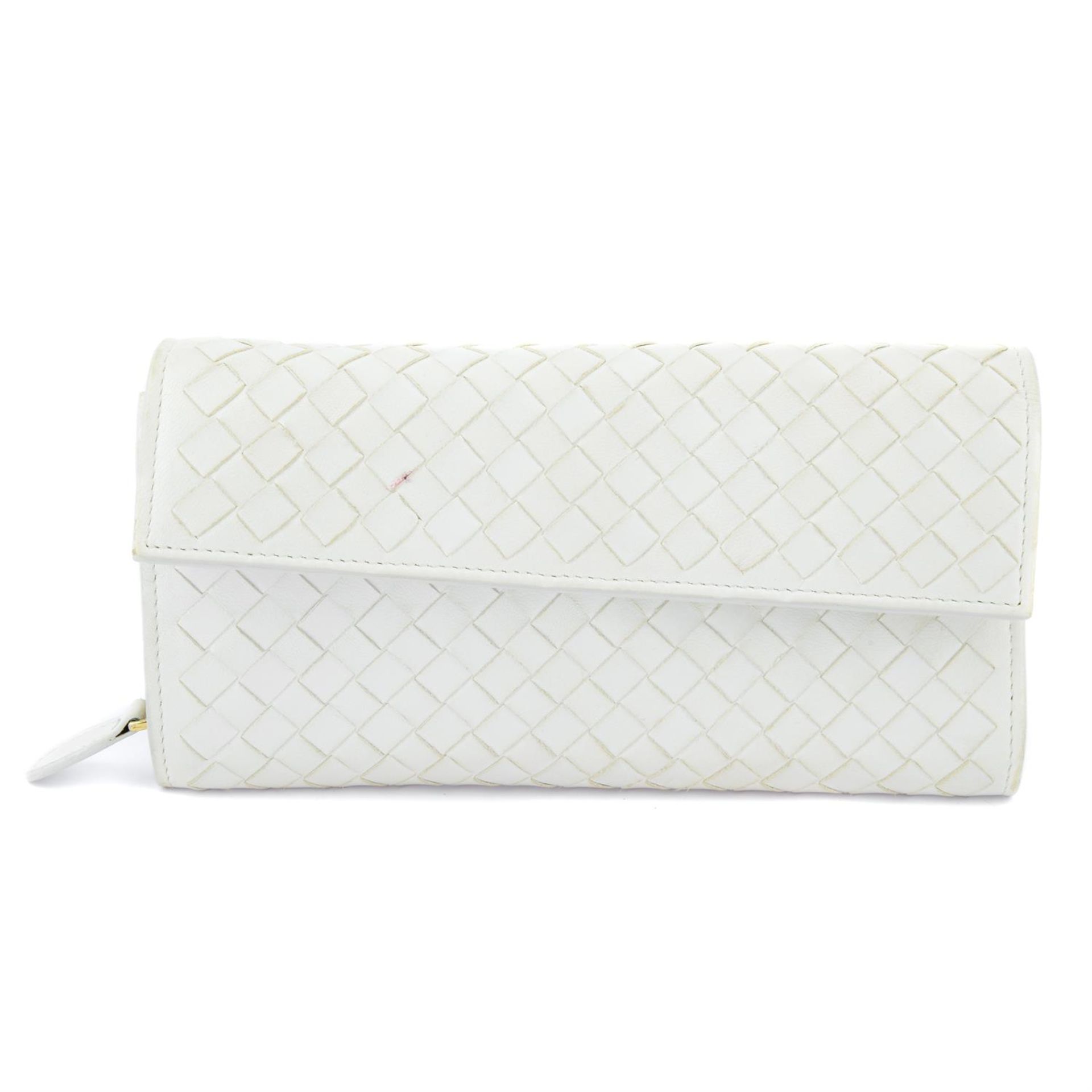 BOTTEGA VENETA - a white Continental wallet.