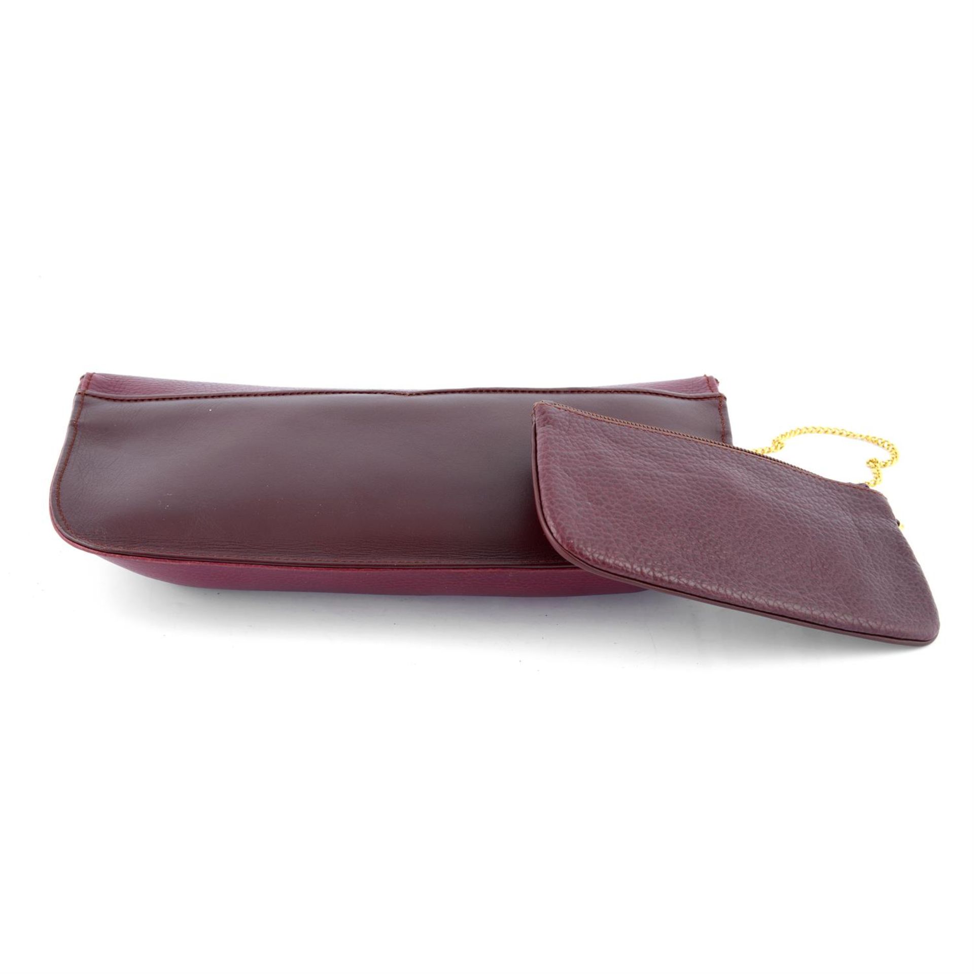 CARTIER - a 1989 red leather clutch. - Image 4 of 4