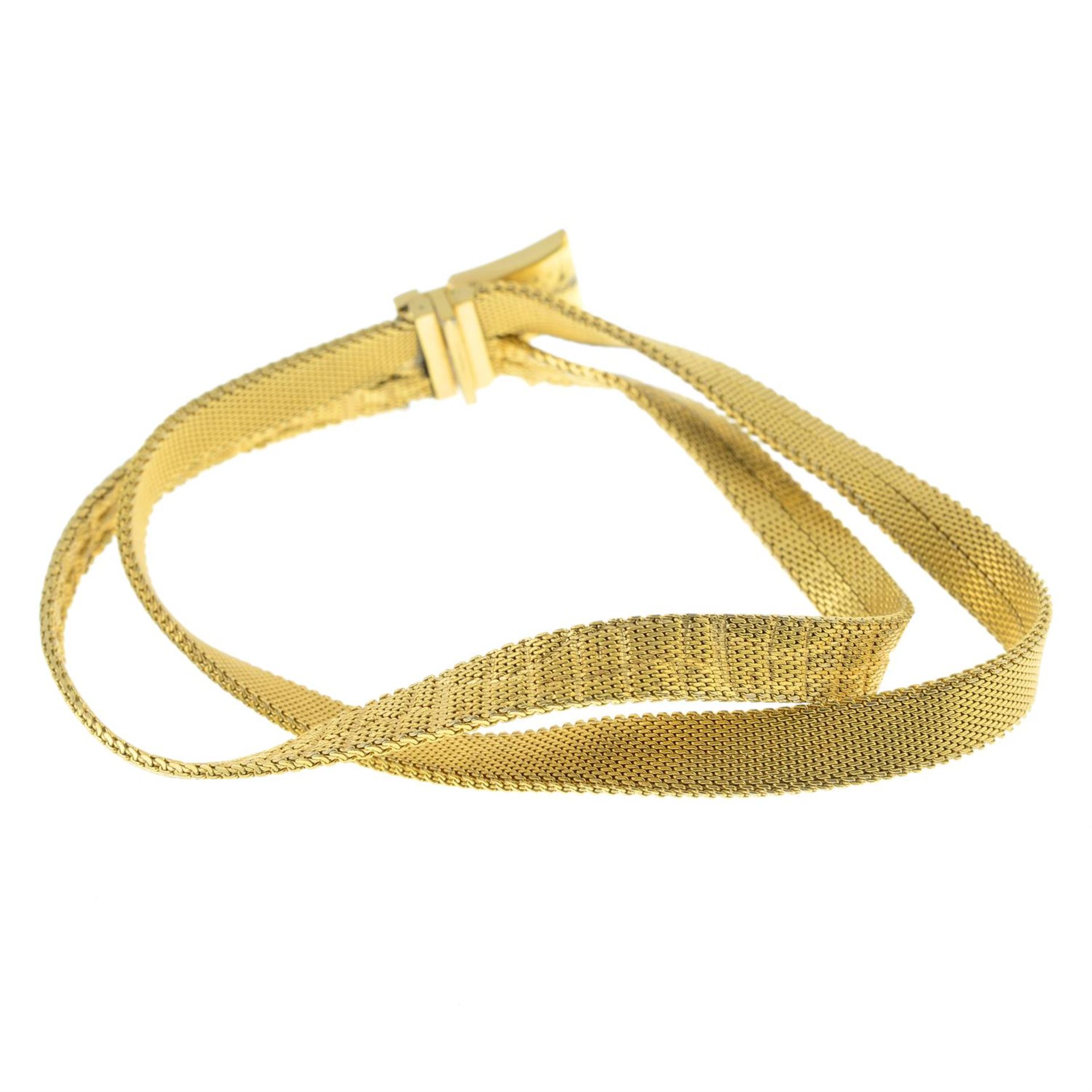 CHRISTIAN DIOR - a metal ribbon bracelet.