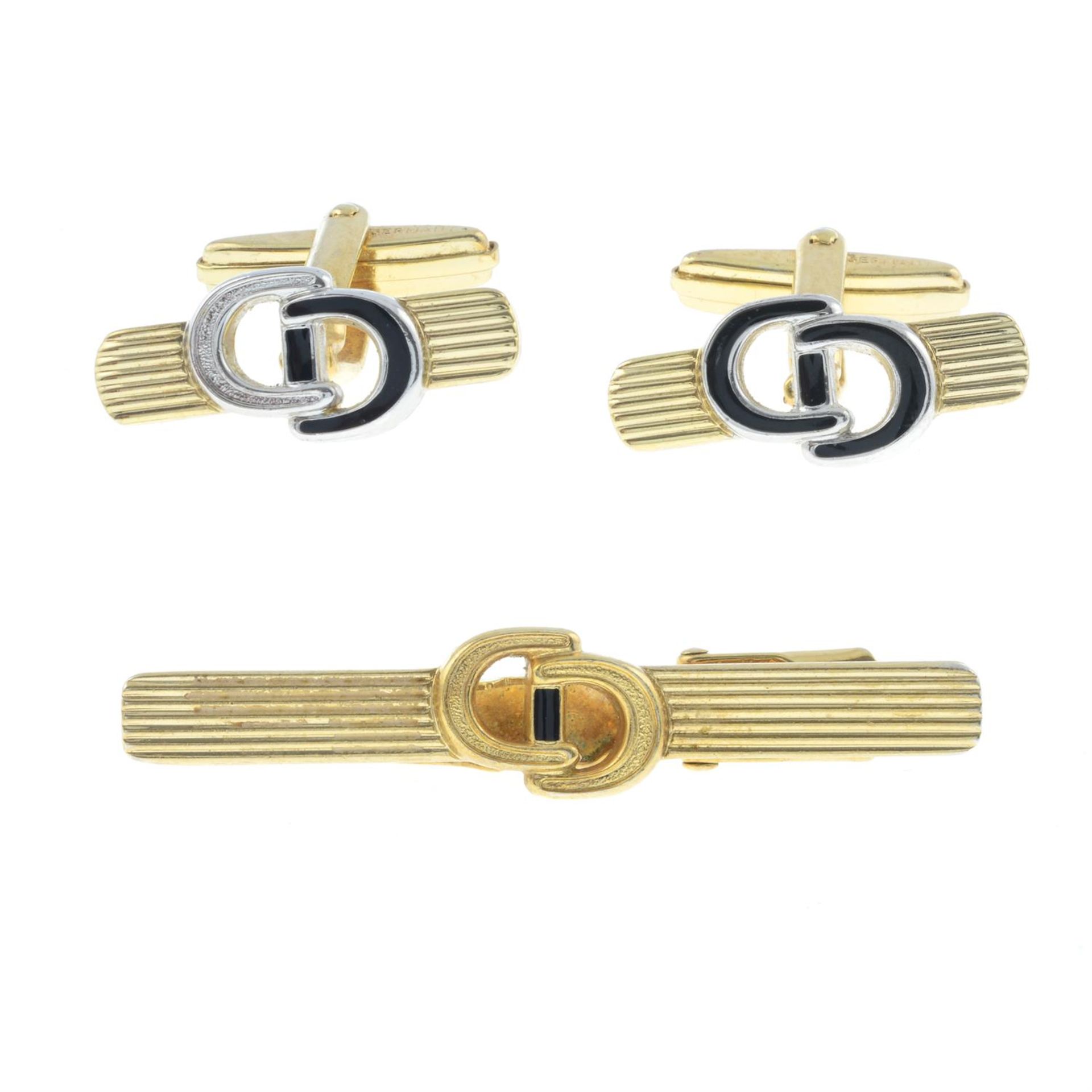 CHRISTIAN DIOR- a pair of cufflinks together with a tie clip.
