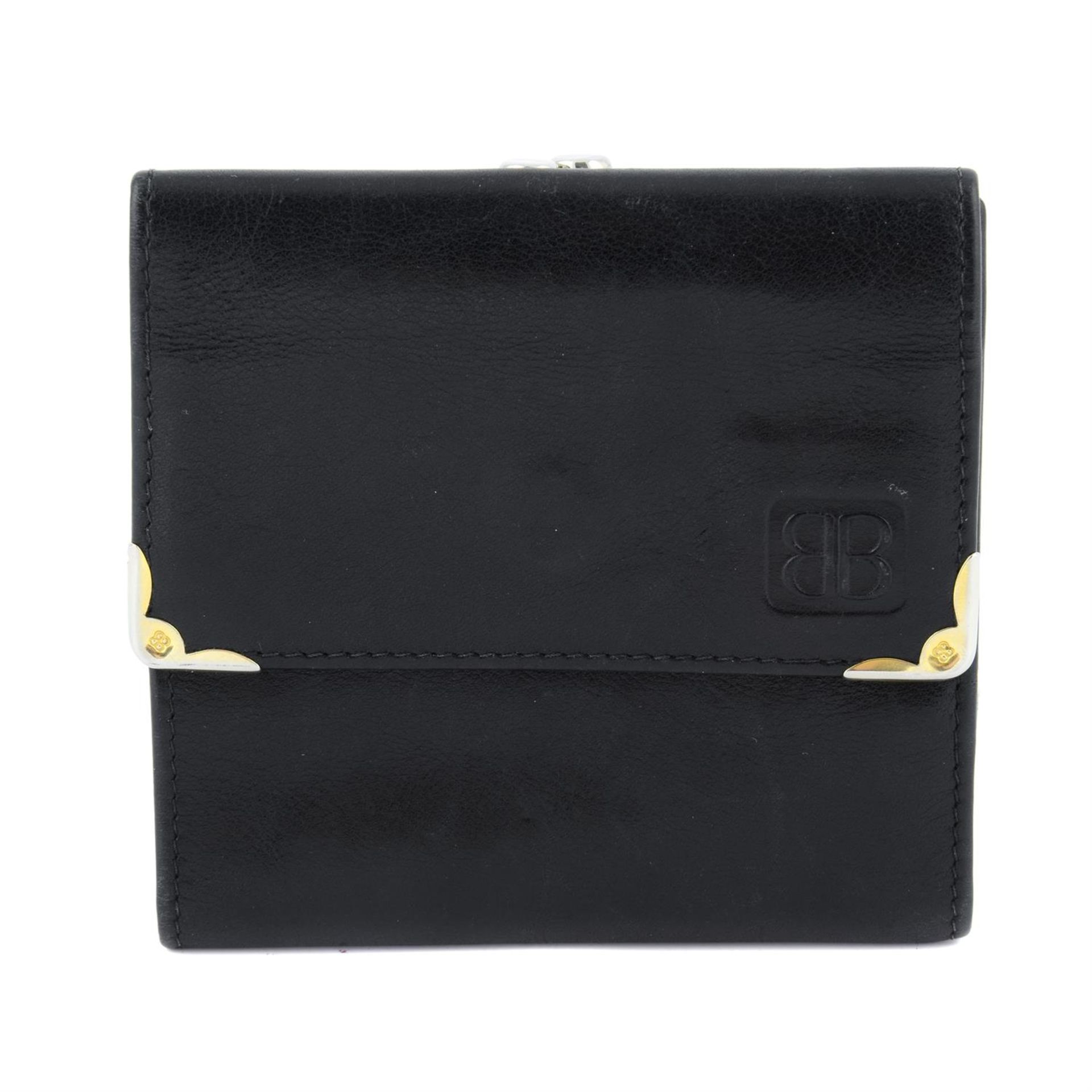 BALENCIAGA - a black leather compact wallet.