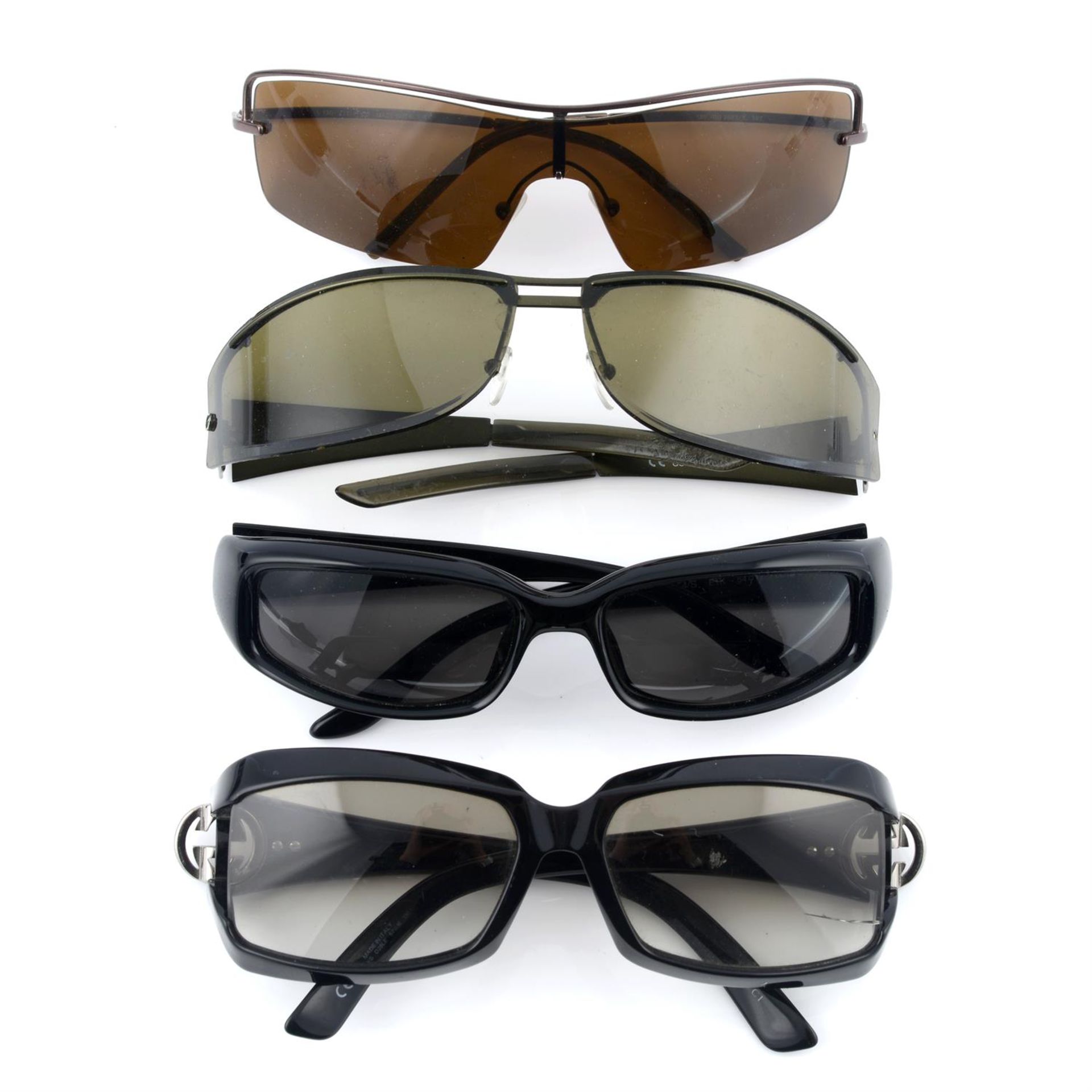 GUCCI - four pairs of sunglasses.